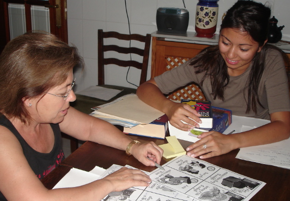 A GeoVisions homestay tutor with her host mom learning English.