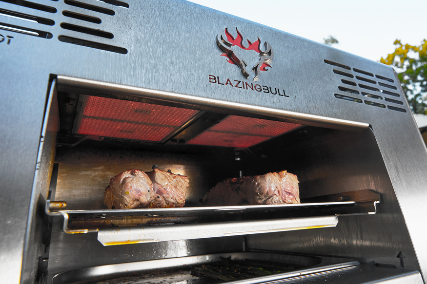 Blazing Bull grilling two steaks at 1500 degrees Fahrenheit