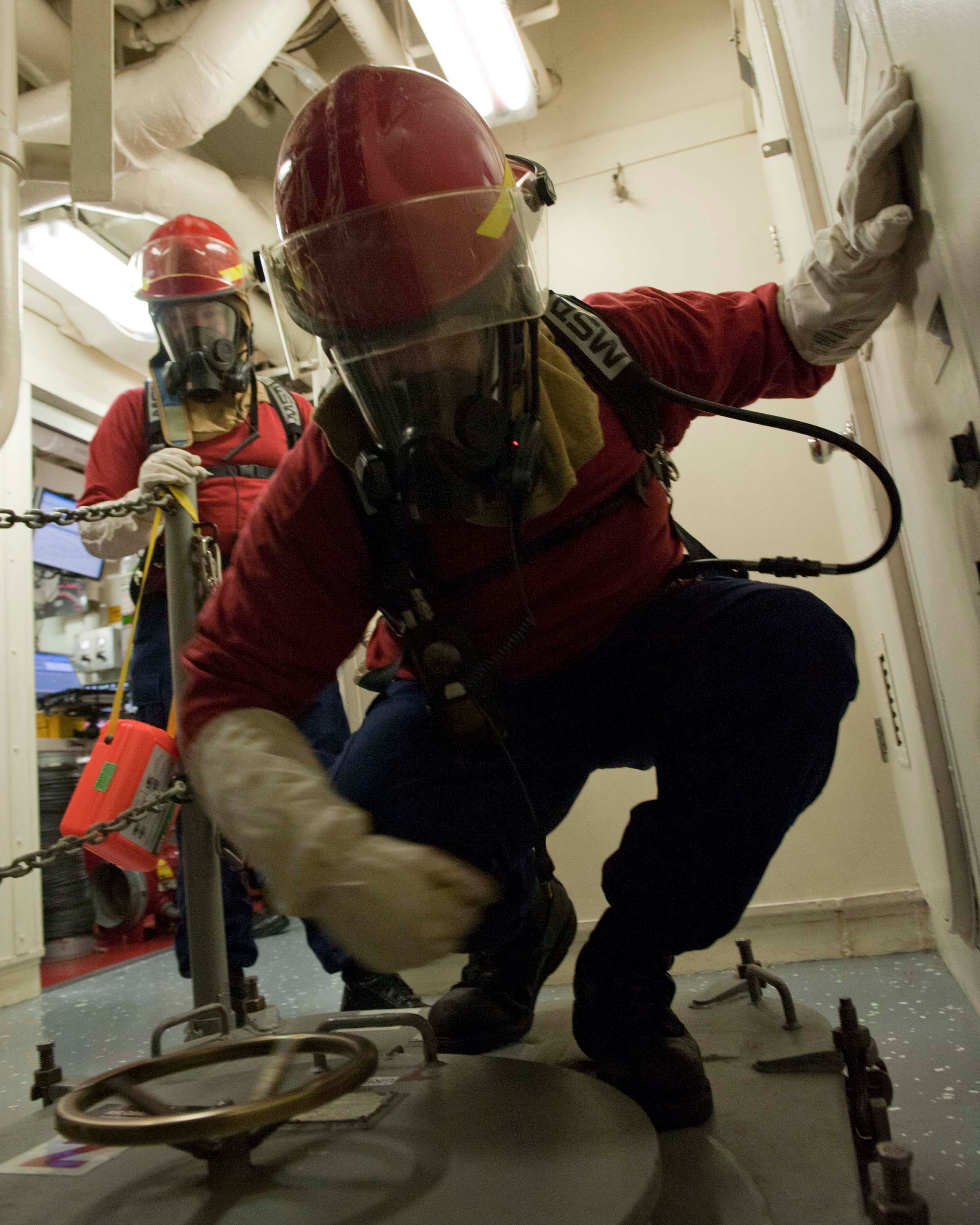 A_U.S._Coast_Guard_fire_team_aboard_the_maritime_security_cutter_USCGC_Bertholf_(WMSL_750)_prepares_to_enter_an_area_during_a_gas_leak_drill_as_part_of_Arctic_Shield_2012_in_the_Arctic_Ocean_120829-G-VS714-118