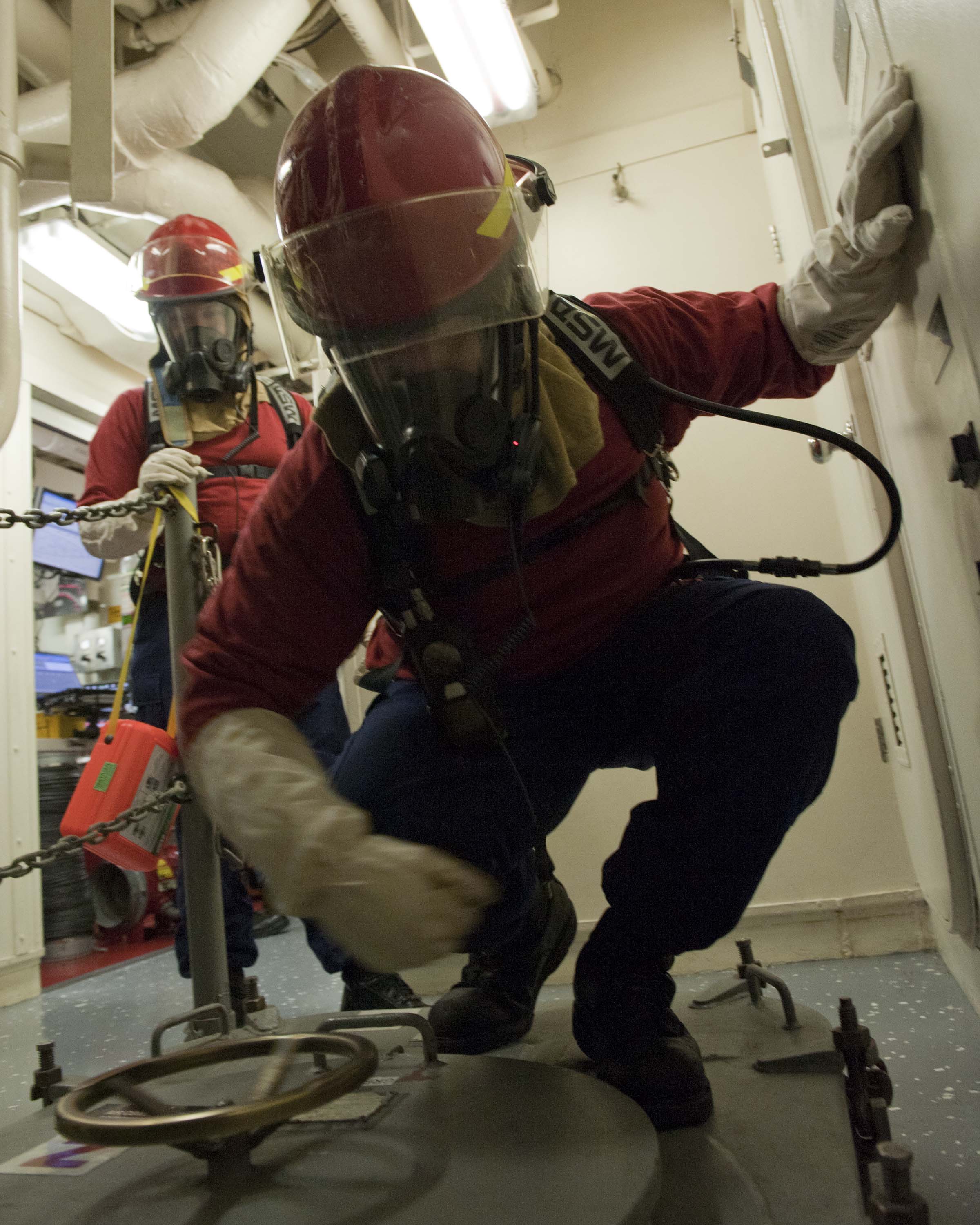 A_U.S._Coast_Guard_fire_team_aboard_the_maritime_security_cutter_USCGC_Bertholf_(WMSL_750)_prepares_to_enter_an_area_during_a_gas_leak_drill_as_part_of_Arctic_Shield_2012_in_the_Arctic_Ocean_120829-G-VS714-118