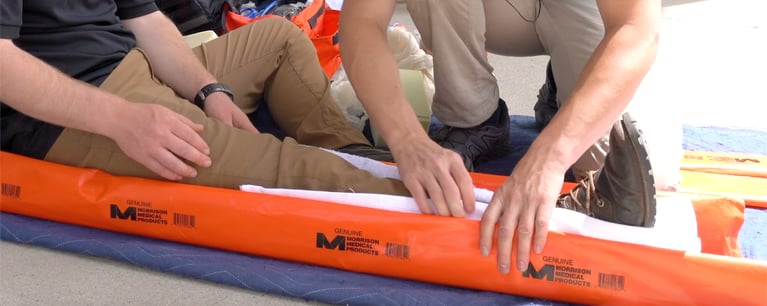 Using a padded board split to stabilize a lower leg injury
