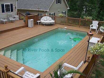 elevated fiberglass pool with wood decking