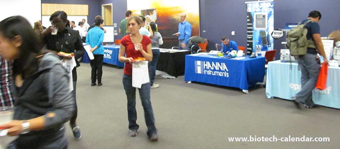 Attendees discovering new leads at Biotechnology Calendar Inc's trade show at the University of Arizona in Tucson.