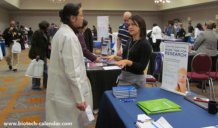 Vendor explains to this scientist what her company has to offer.