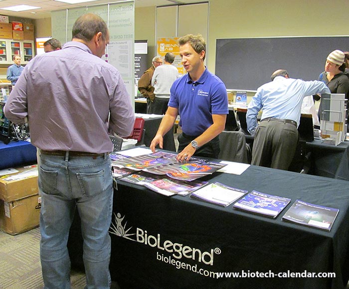 BioLegend's exhibitor explains his company's laboratory equipment.