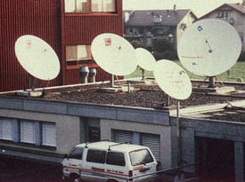 Kilchenmann History 1970 shows satellite dishes on roof