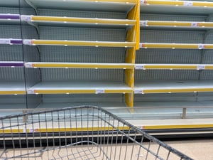Empty supermarket shelves during panic buying in UK - March 2020