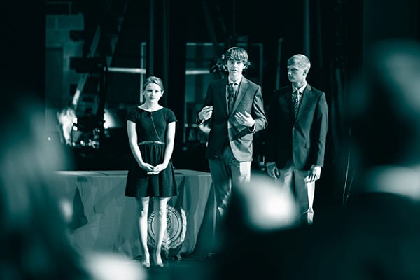 Three students presenting