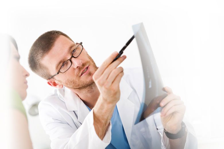Chiropractor in Memphis talking to a patient about low back disc degeneration