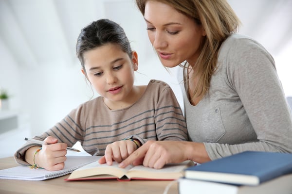 Mother Helping Daughter with Homework