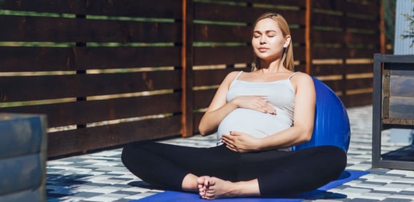 pregnant-woman-meditating-outside