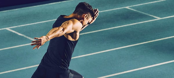 olympic athlete running on track