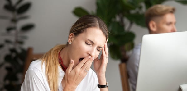Women tired at desk