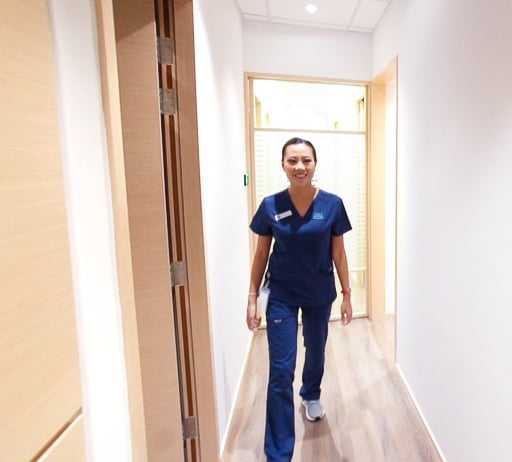 nurse walking through clinic