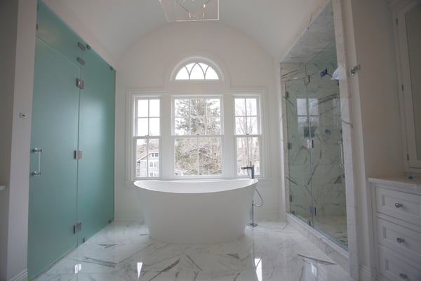 Glass shower enclosure and custom frosted glass doors