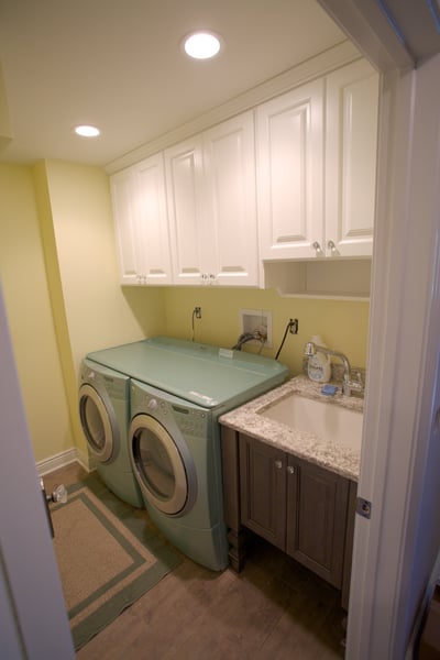 White Laundry Upper Section with Raised Panel Doors, Crystal Knobs, and Accessory Shelf