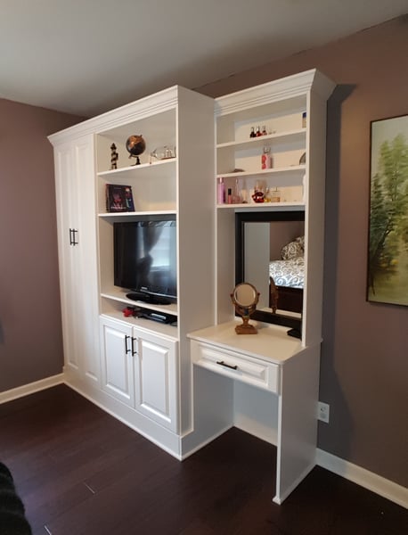 White Bedroom Built In with Vanity Space, Media Center, and Full Height Doors with Decorative Base and Crown Moulding