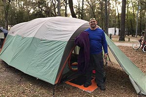 Author standing in front of camping tent