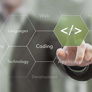 person touching an overlay graphic that represents coding