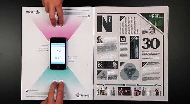 Interactive print advertisement by Sonera featuring smartphone boardgame