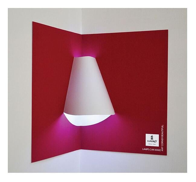 Interactive print advertisement by Lladro Lighting with lamp shade included in pop-up book