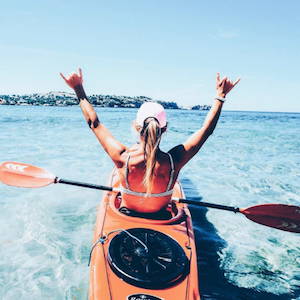 Divinity LA Bracelets Instagram account showing woman kayaking