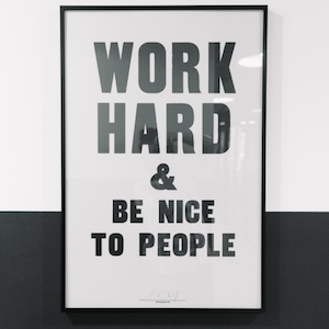 WeWork's most engaging Instagram post showing sign 'Work Hard & Be Nice to People'