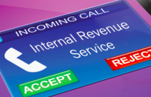 An image of an incoming call from the IRS on a phone screen.