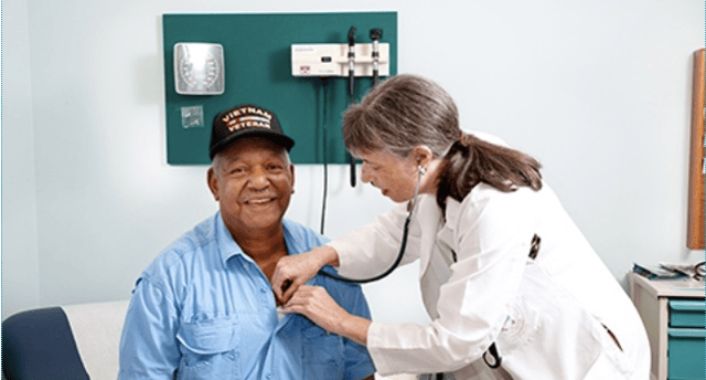 A Vietnam Veteran gets a check up from a VA doctor