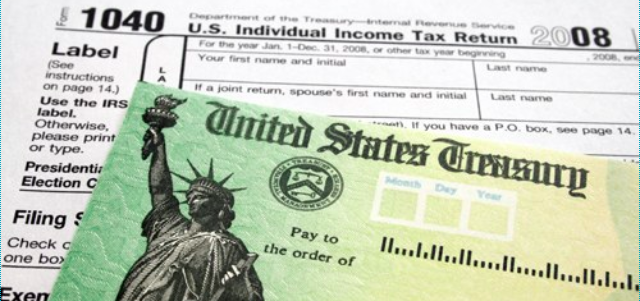 A U.S. Treasury check sits on a tax form. 