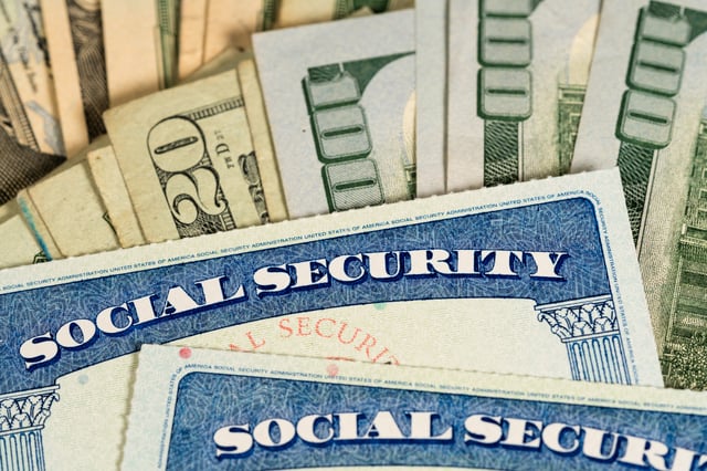 Social Security cards and U.S. dollars