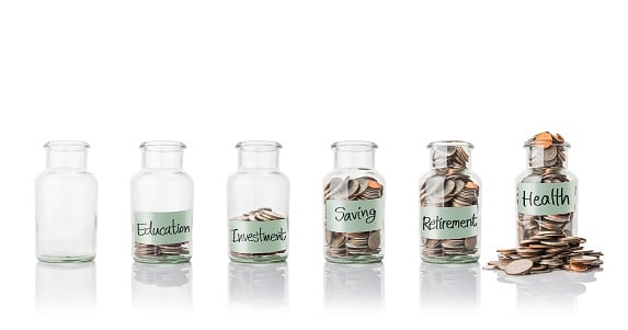 Saving jars on a white background for education, investment, savings, retirement and health. 