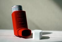 Picture of an inhaler. Link goes to EPA's page on asthma.