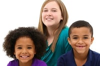 Several children smile for the camera. Lin goes to ChildWelfare's page on Foster Care Month.
