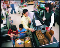 A family buys groceries together. Link goes to MyPlate's page on grains.