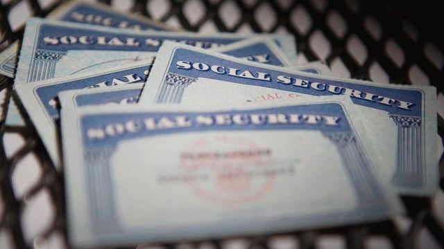 Social Security cards on top of each other. 