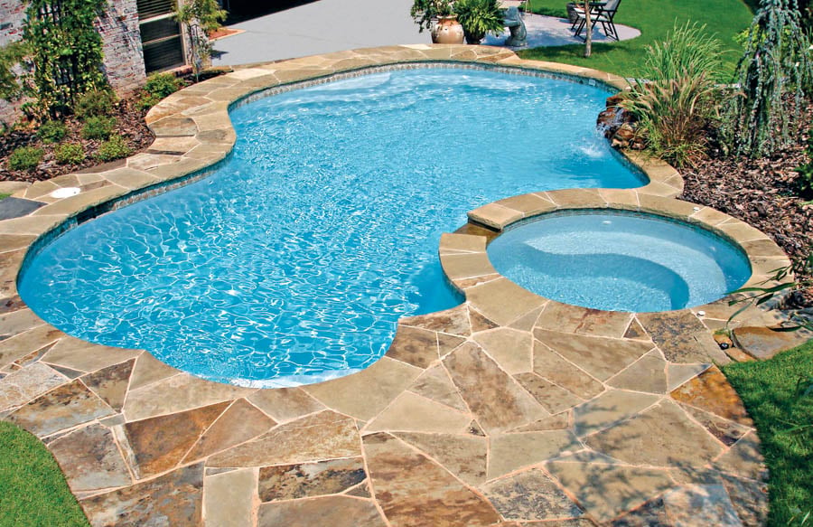 residential swimming pool with durable quartz interior finish and spa