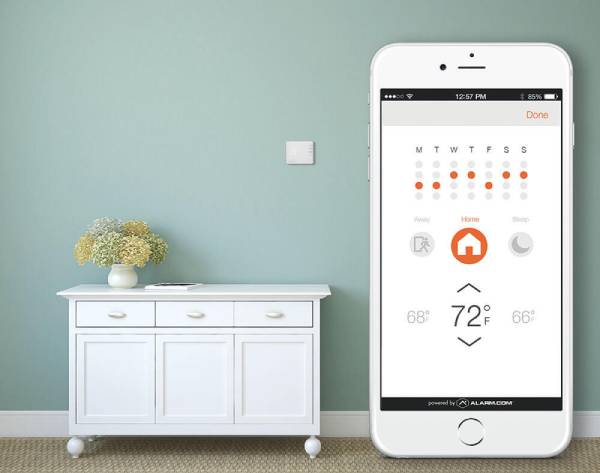 Alarmcom_Smart_Thermostat_on_wall_opti