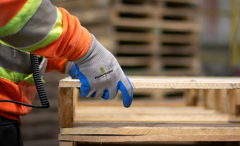 Employee working on remanufactured pallets