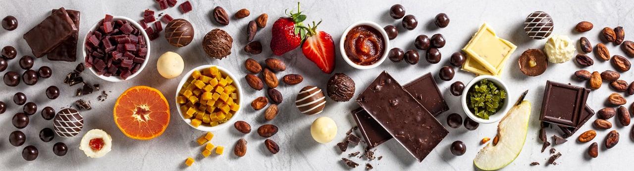 iStock-856324366-beautiful-young-woman-biting-chocolate