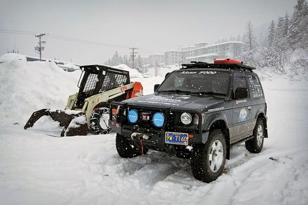 Pajero-next-to-running-skid-steer-in-Whittier-Alaska
