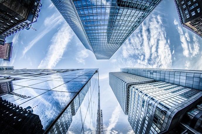 low-angle-photo-of-four-high-rise-curtain-wall-buildings-830891