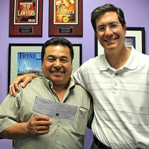 Javier-Beltran-with-Vuk-holding-check-April-2015