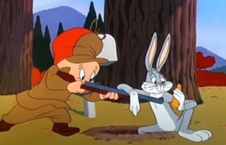 elmer-fudd-aiming-rifle-at-bugs-bunny-looney-tunes-cartoon-490x315-1-e1591880618270