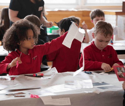 Students working collaboratively on a collage