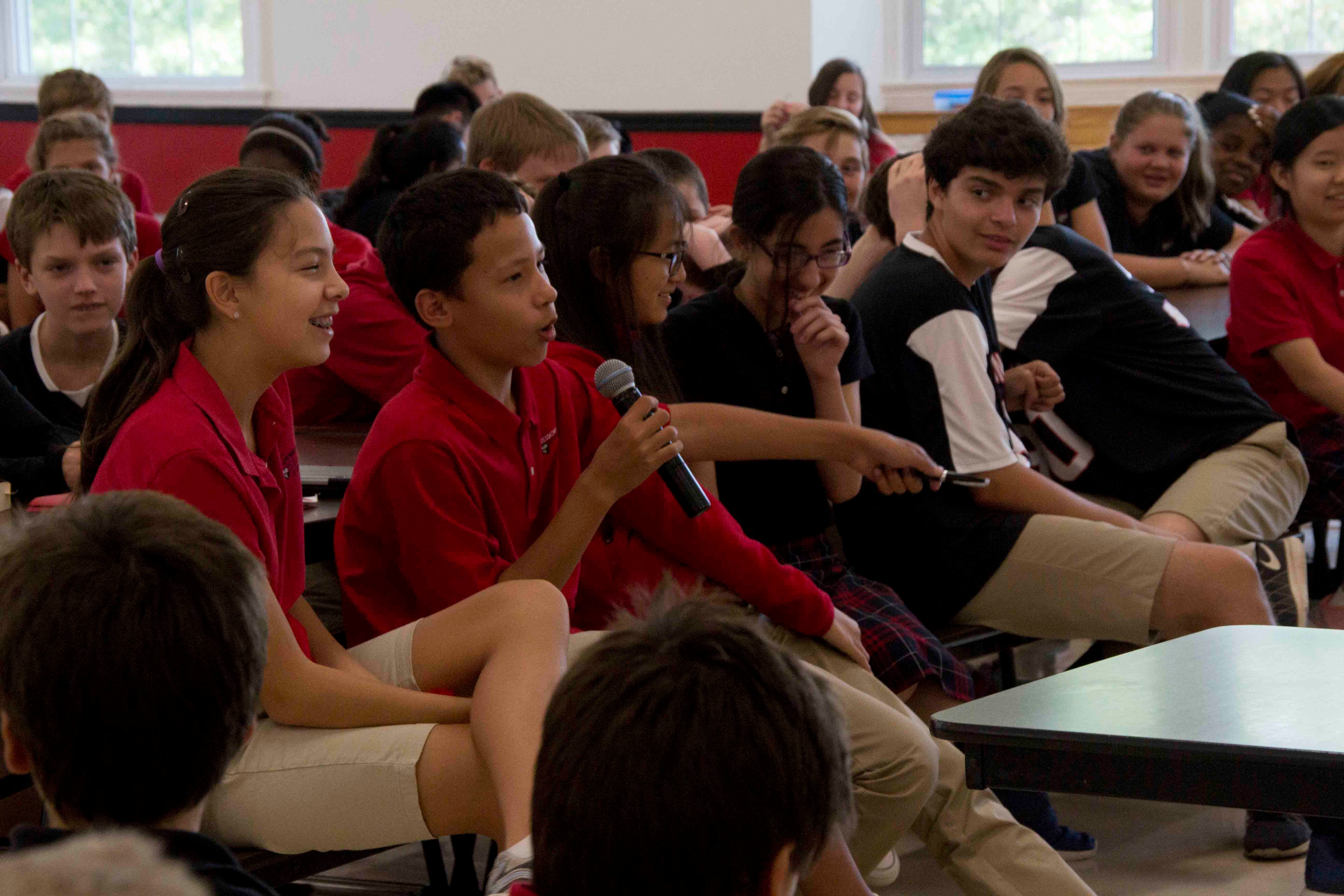 student speaking microphone