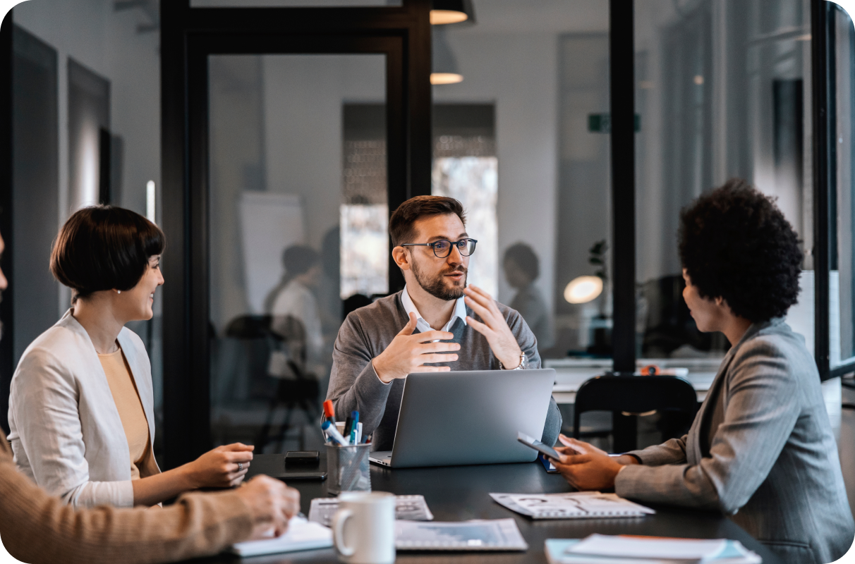 Professionals sitting in a meeting room and talking