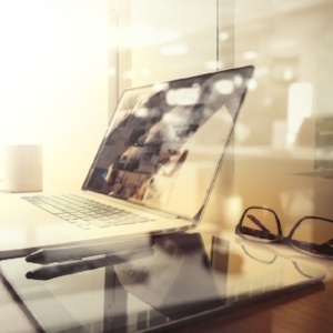 Office workplace with laptop and smart phone on wood table and london city blurred background-335112-edited.jpeg