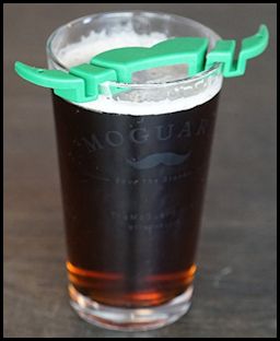 mustache guard on a beer glass