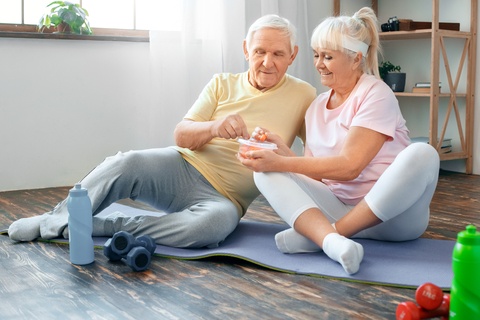 senior couple exercising and eating healthy